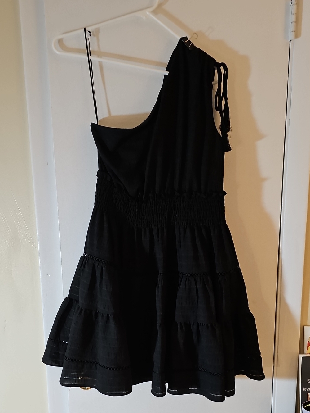 Taylor Black Garment with White Brand Tag